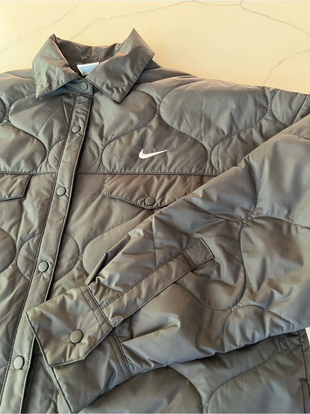 Nike Quilted Puffer Jacket in Black with White Swoosh